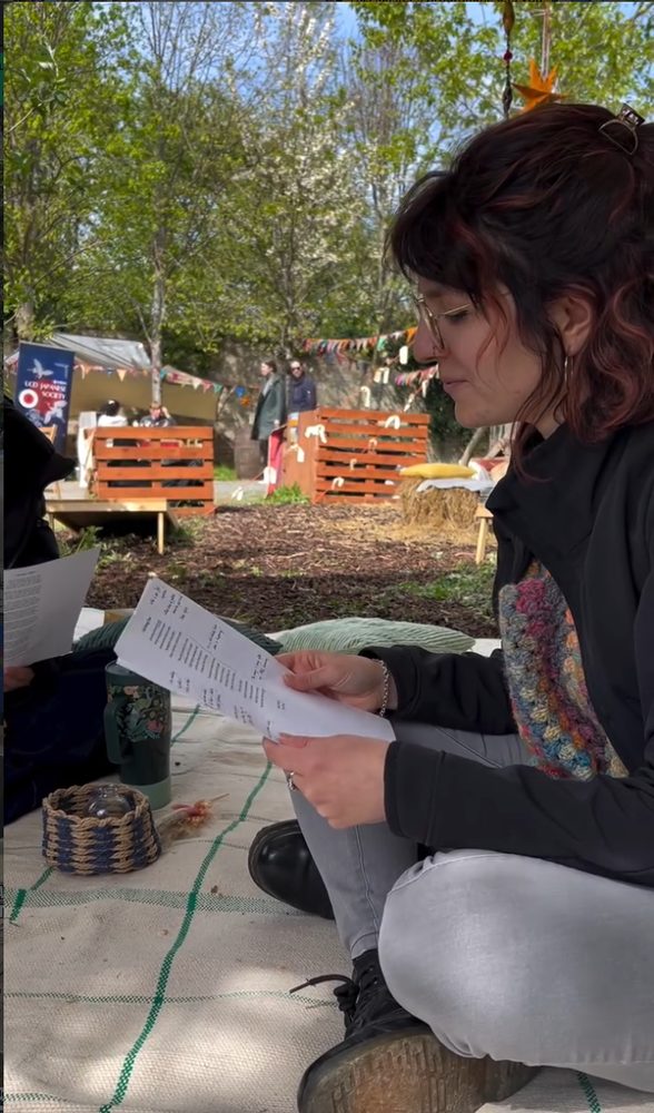 Shared reading activity outdoors at Greenacre during Bealtaine